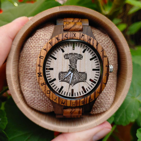 Handmade Viking wooden watch with Thor's Hammer engraving displayed on wrist