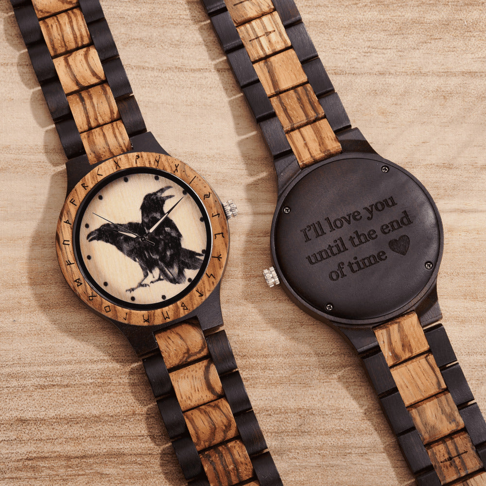 Wooden watches with engraved designs on a wooden surface