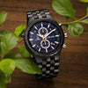 Close-up of engraved back of ebony wooden watch with custom text