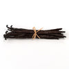 Bunch of vanilla beans tied with a string on a white background