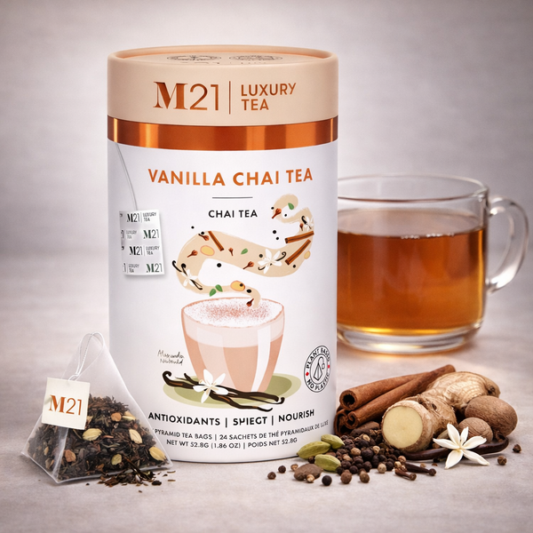 M21 Vanilla Chai Tea packaging with a cup of tea and tea ingredients on a gray background