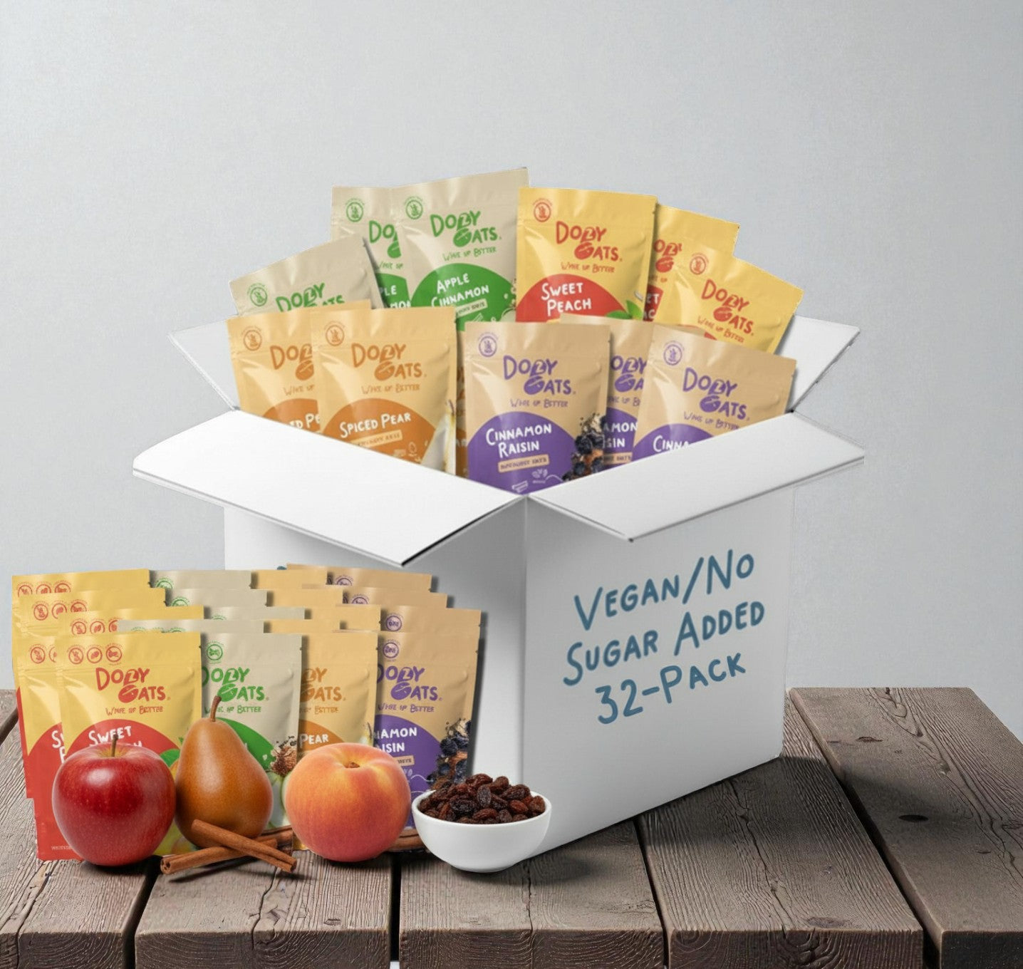 Box of Dory Oats vegan/no sugar added 32-pack with fruits and a bowl on a wooden surface.