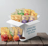Box of Dory Oats vegan/no sugar added 32-pack with fruits and a bowl on a wooden surface.