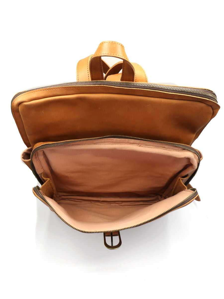 Open brown leather backpack on a white background