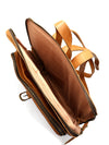 Brown leather bag with a strap on a white background