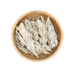 Wooden bowl filled with dried herbs on a white background