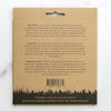 Back of a cardboard package with text and a barcode on a white background