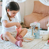 Child playing with toys on a carpeted floor