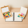 Lifestyle flatlay of the elseware unplug Watercolor Essentials Bundle on a wooden surface