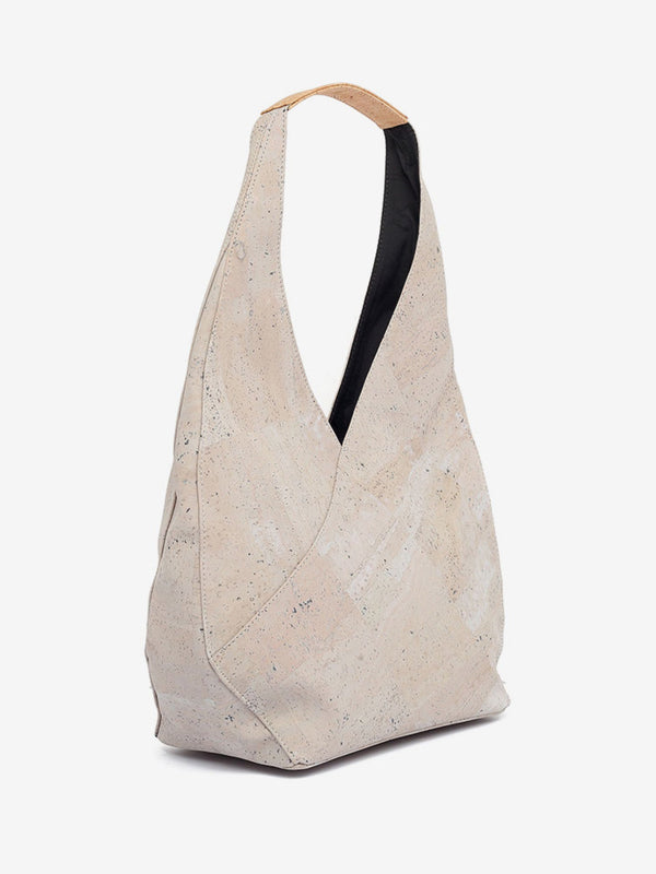 Beige tote bag with black strap on a white background