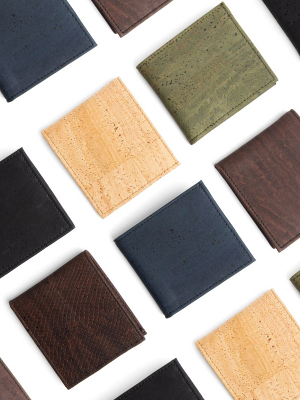 Collection of cork wallets in various colors on a white background