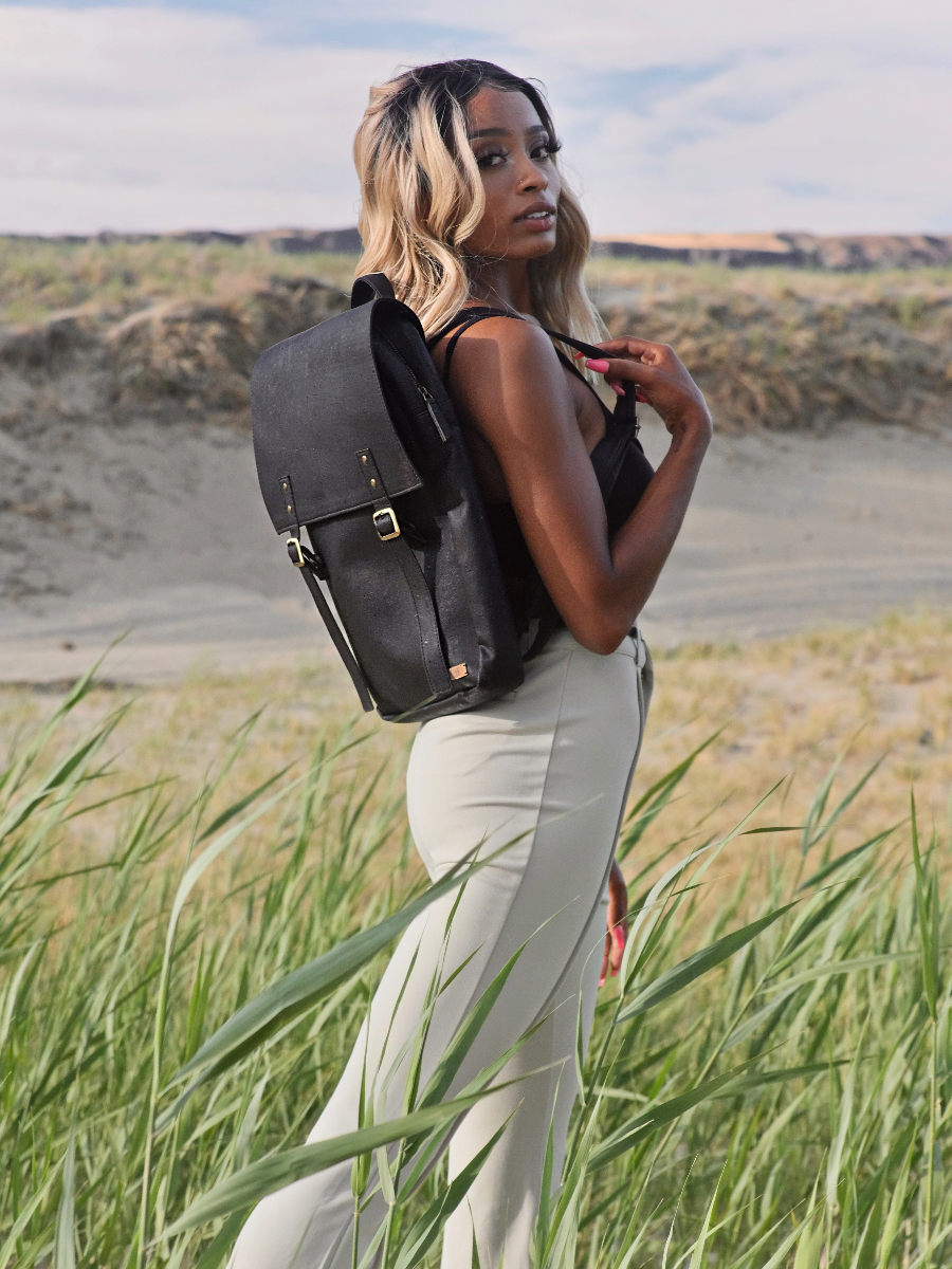 Tiradia Cork Backpack styled for travel — PETA-approved vegan bag made from sustainably sourced cork