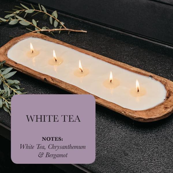 Experience the tranquility of our White Tea 5-Wick Soy Candle. Hand-poured in a beautiful dough bowl, this candle offers a calming fragrance and a sustainable, eco-friendly choice.