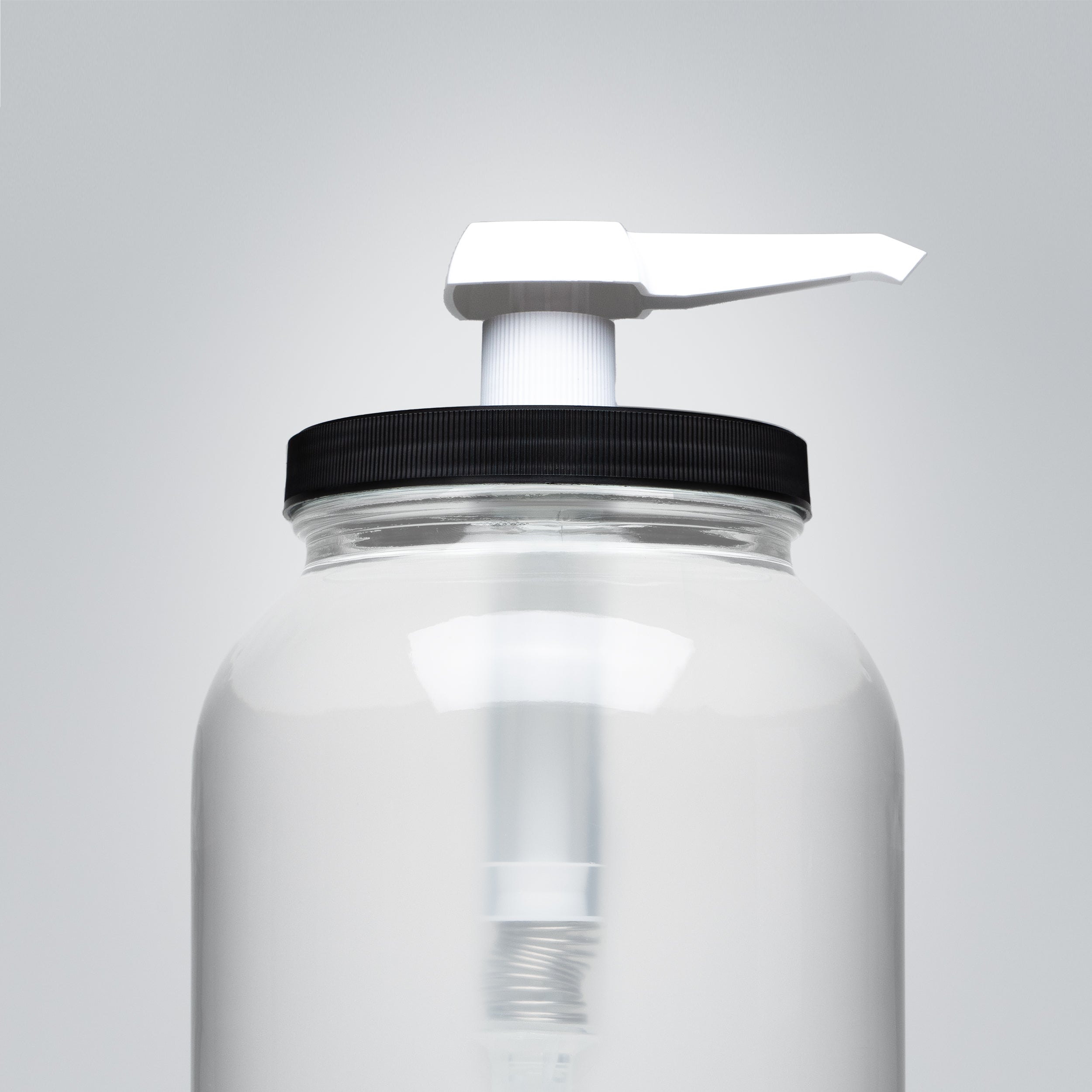 Rustic Strength pump attached to a 1-gallon wide mouth jar