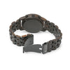 Joycoast Wild wooden chronograph watch showing zebrawood grain detail and three subdials on a flat lay surface