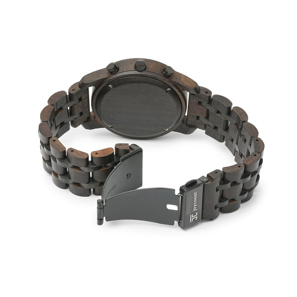 Joycoast Wild wooden chronograph watch showing zebrawood grain detail and three subdials on a flat lay surface
