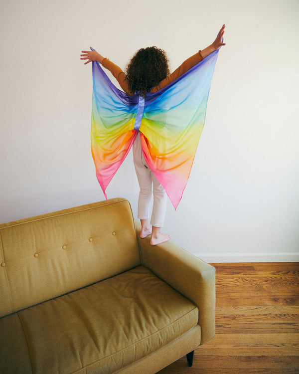 Transform your child into a superhero with Sarah's Silks Rainbow Butterfly Wings! Made from 100% real silk, these wings are perfect for imaginative play and dress-up. Eco-friendly and comfortable. 