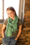 Close-up of Fair Anita Woven Simplicity Scarf in jade showing cotton weave texture and fringe detail