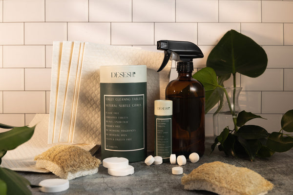 Desesh plastic-free cellulose dish sponge displayed with sustainable home cleaning products