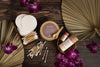 Reusable cotton makeup remover pads by Desesh displayed with sustainable skincare products including deodorant, lip balm, face mask, and bamboo ear swabs