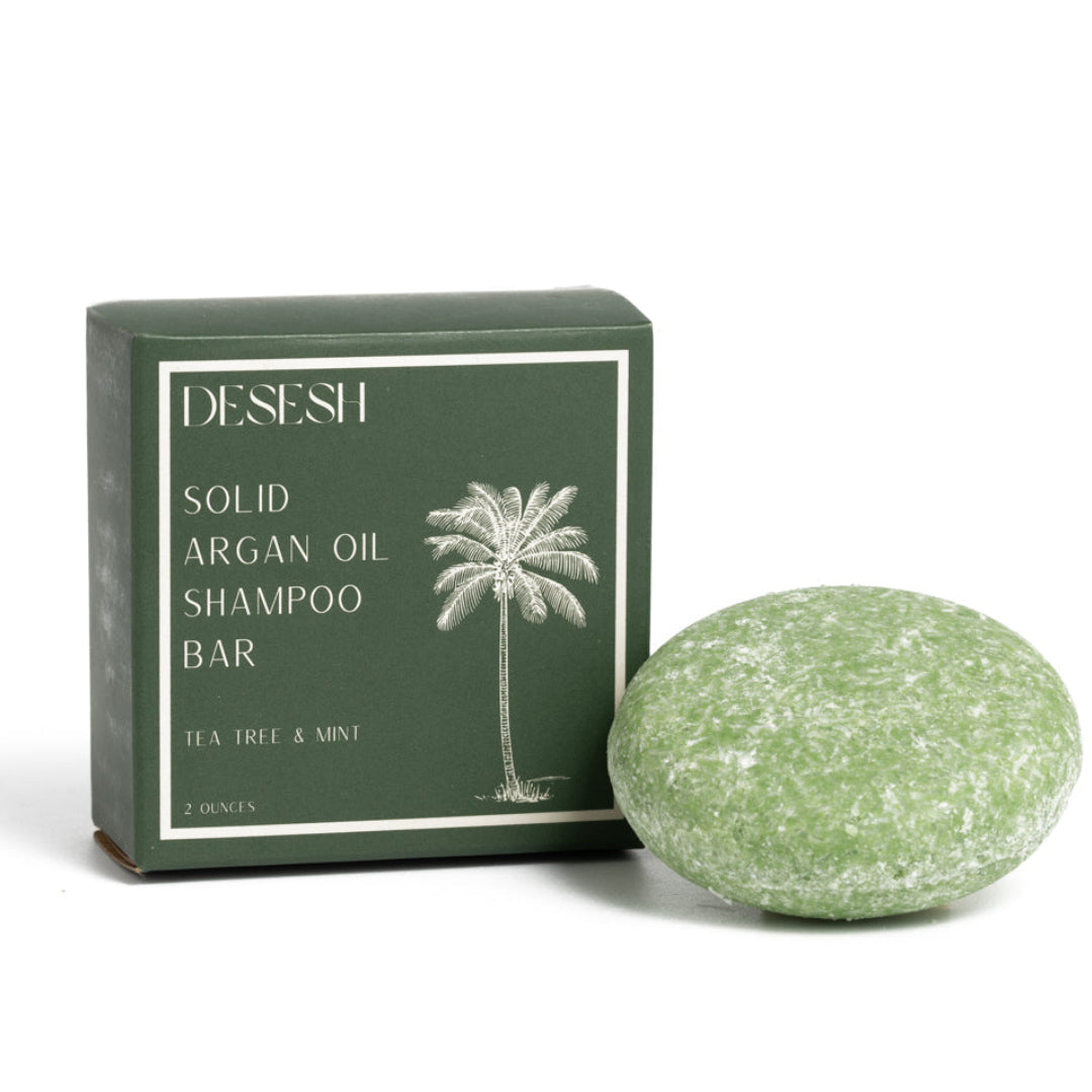 Desesh solid argan oil shampoo bar with tea tree and peppermint essential oils in plastic-free compostable packaging