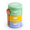 JusTea Assorted Trio organic tea gift set with three stackable tins and hand-carved Kenyan olive-wood spoons