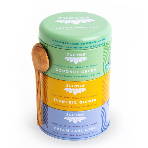 JusTea Assorted Trio organic tea gift set with three stackable tins and hand-carved Kenyan olive-wood spoons