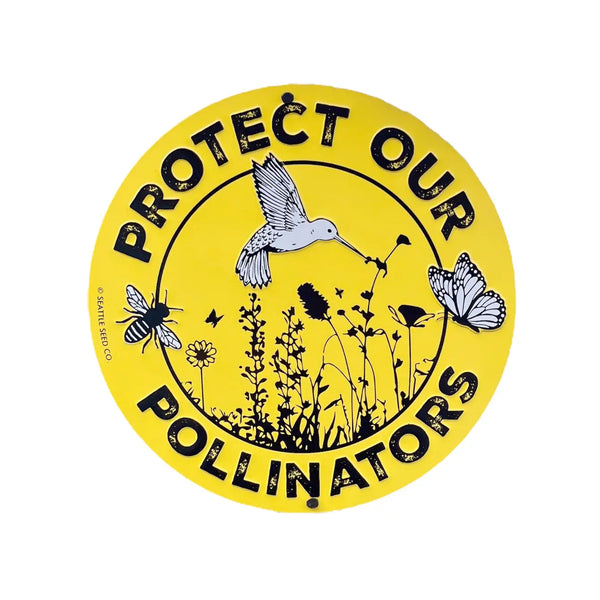 Close-up of the embossed metal pollinator garden sign showing detailed bee, butterfly, and bird design on a round aluminium panel