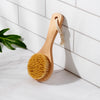 Bamboo dry body brush with natural sisal bristles — exfoliates, boosts circulation & supports lymphatic drainage. Plastic-free, zero waste & eco-friendly. Shop now.