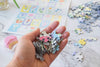 ABC Flowers puzzle pieces from Oakland Puzzle Company laid out in a lifestyle setting