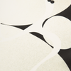 Abstract design with black and white shapes on a beige background