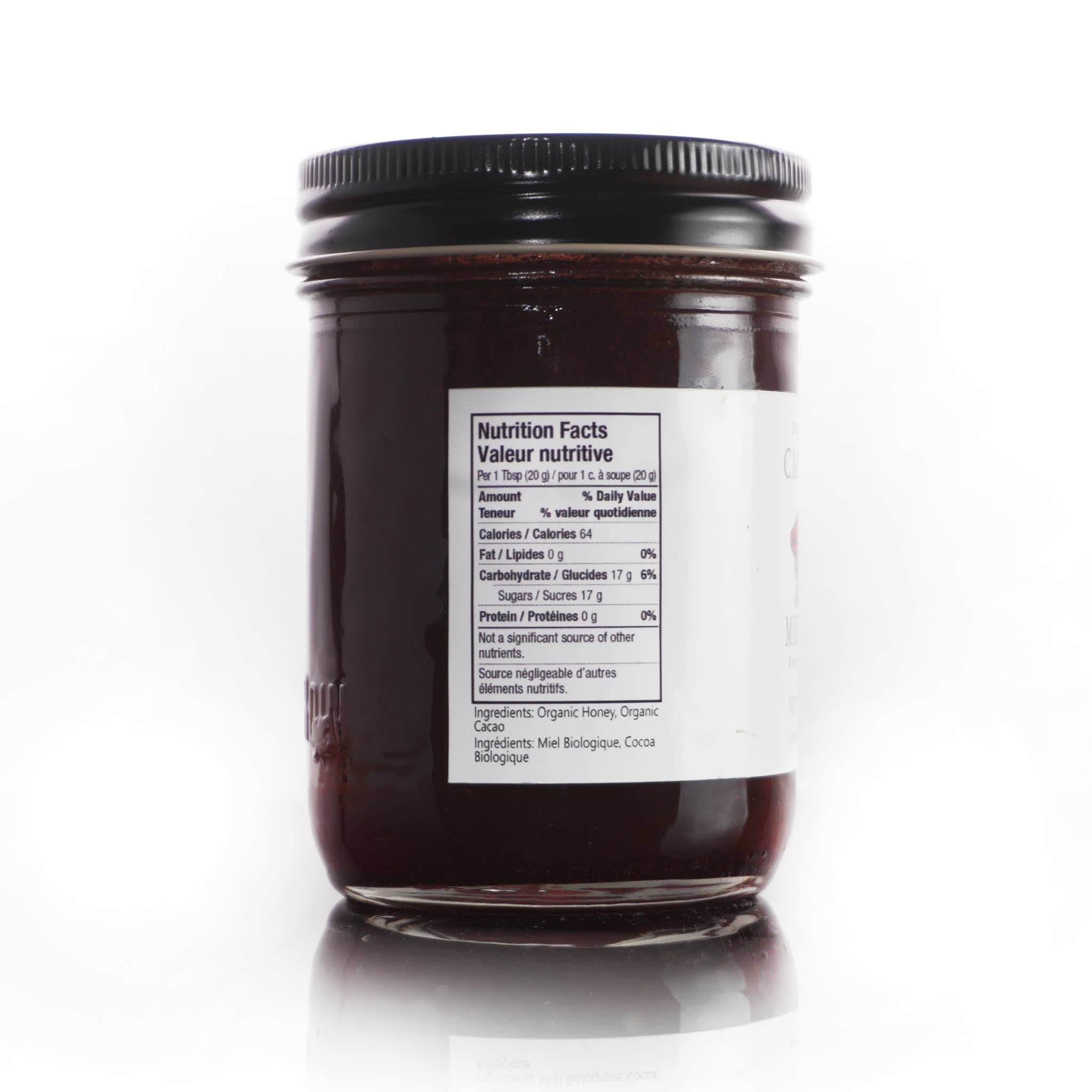 Jar of dark chocolate spread with a nutrition label on a white background