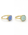 Adjustable semi-precious stone ring in gold-plated recycled brass on a flat surface