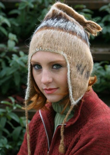 Person wearing a knitted hat with animal ears outdoors