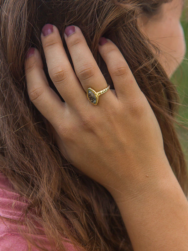 Fair Anita almond black rutile quartz stone ring styled on hand