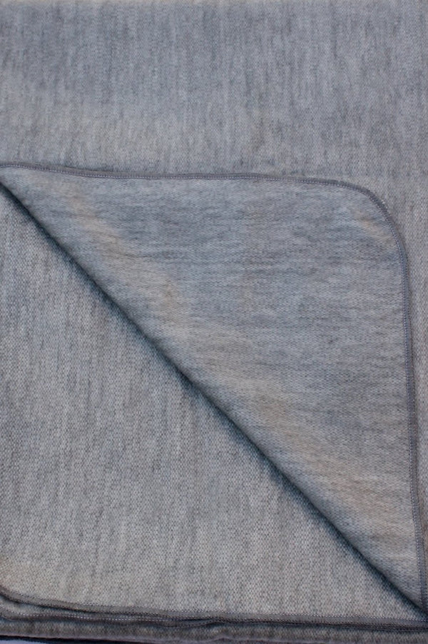 Gray textured fabric with a diagonal fold