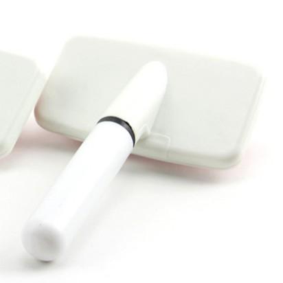 White electronic device with a black accent on a white background