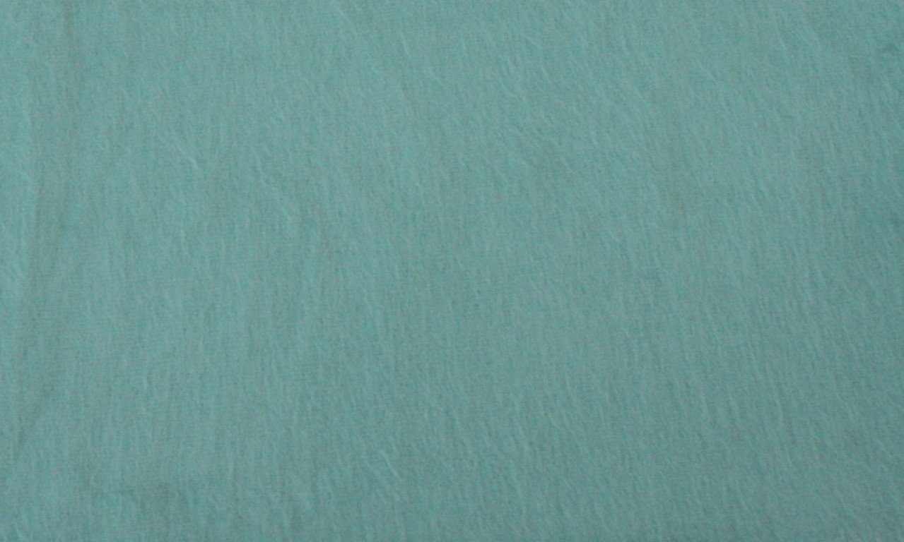 Solid teal color swatch with a textured surface