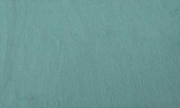 Solid teal color swatch with a textured surface