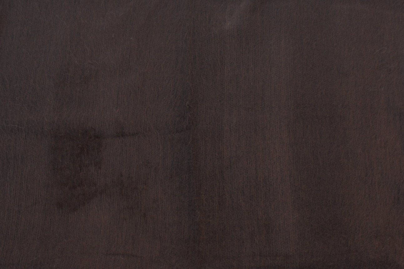 Close-up of a textured brown fabric surface
