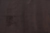Close-up of a textured brown fabric surface