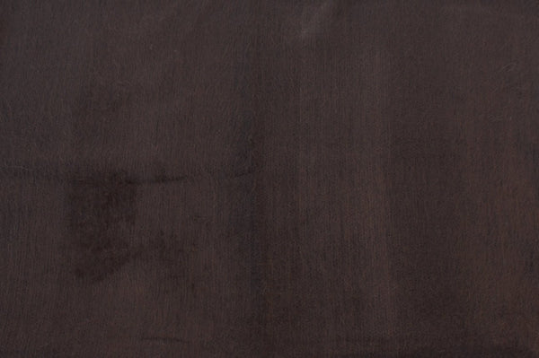 Close-up of a textured brown fabric surface