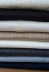 Close-up of natural alpaca fibre bed blanket showing smooth texture and weave
