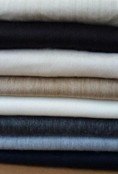 Close-up of natural alpaca fibre bed blanket showing smooth texture and weave