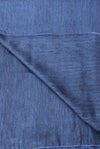 Close-up of blue fabric with a subtle pattern