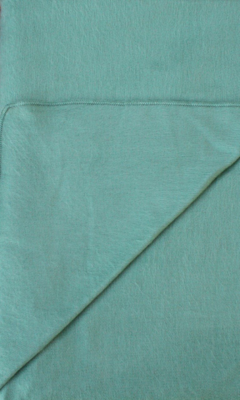 Teal fabric with a visible seam
