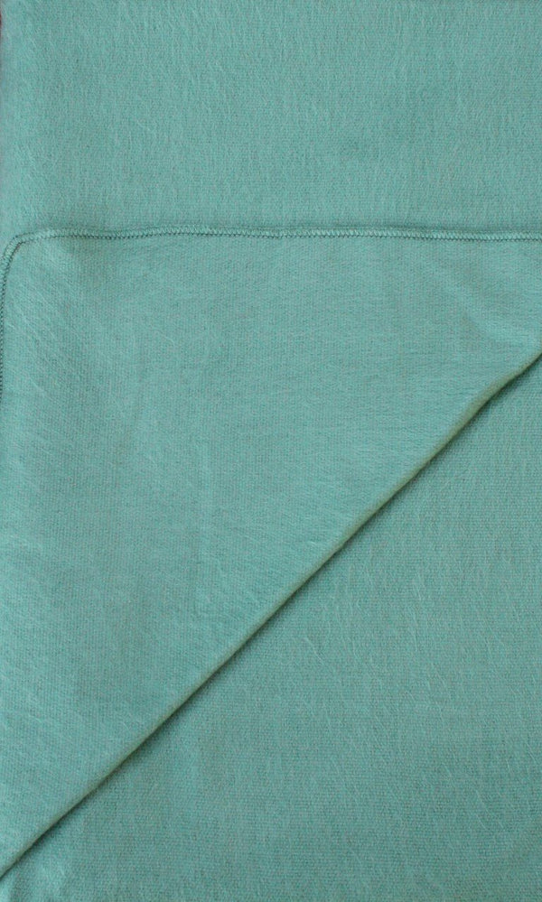 Teal fabric with a visible seam