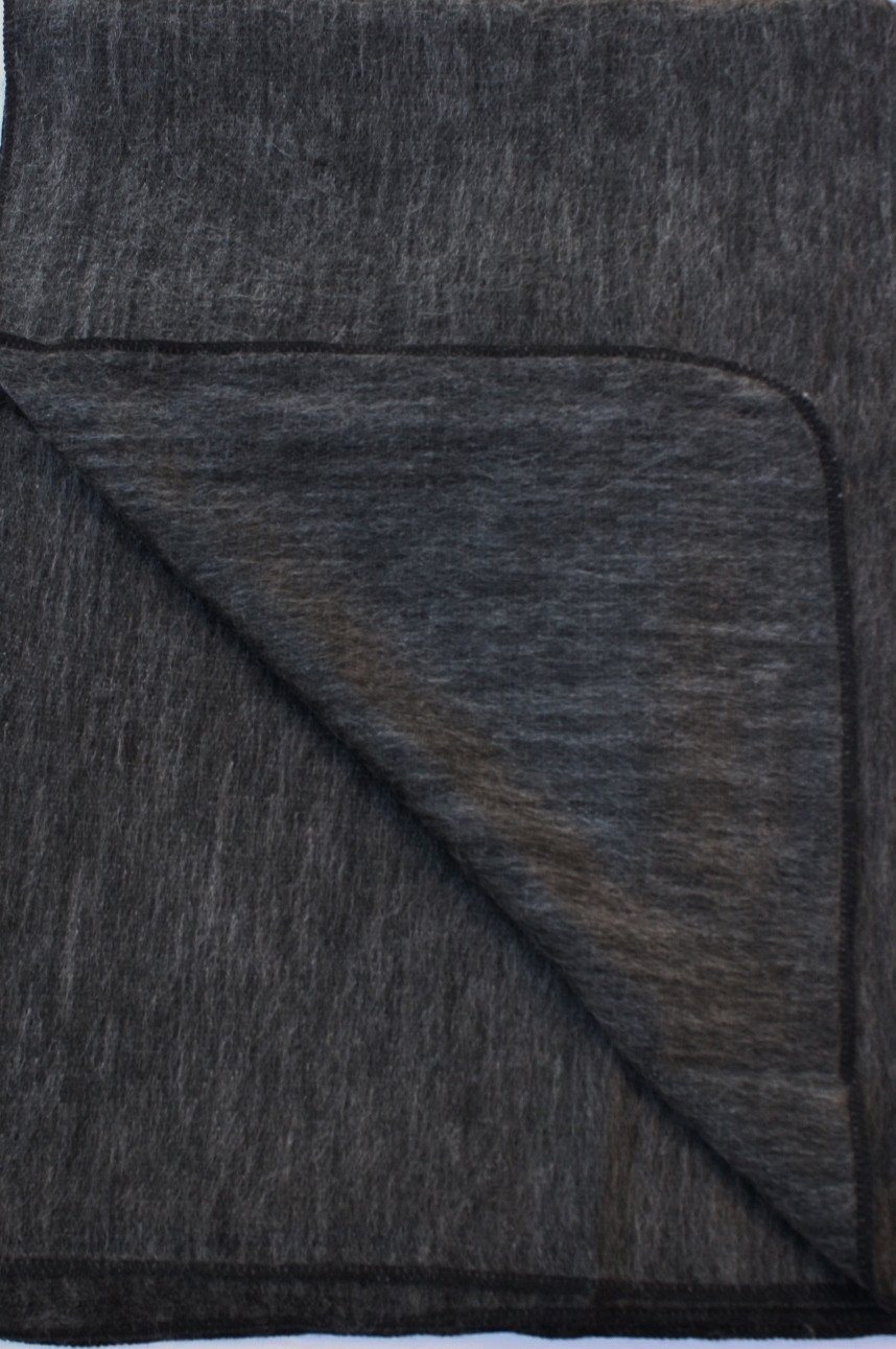 Dark gray fabric with a subtle pattern on a white background