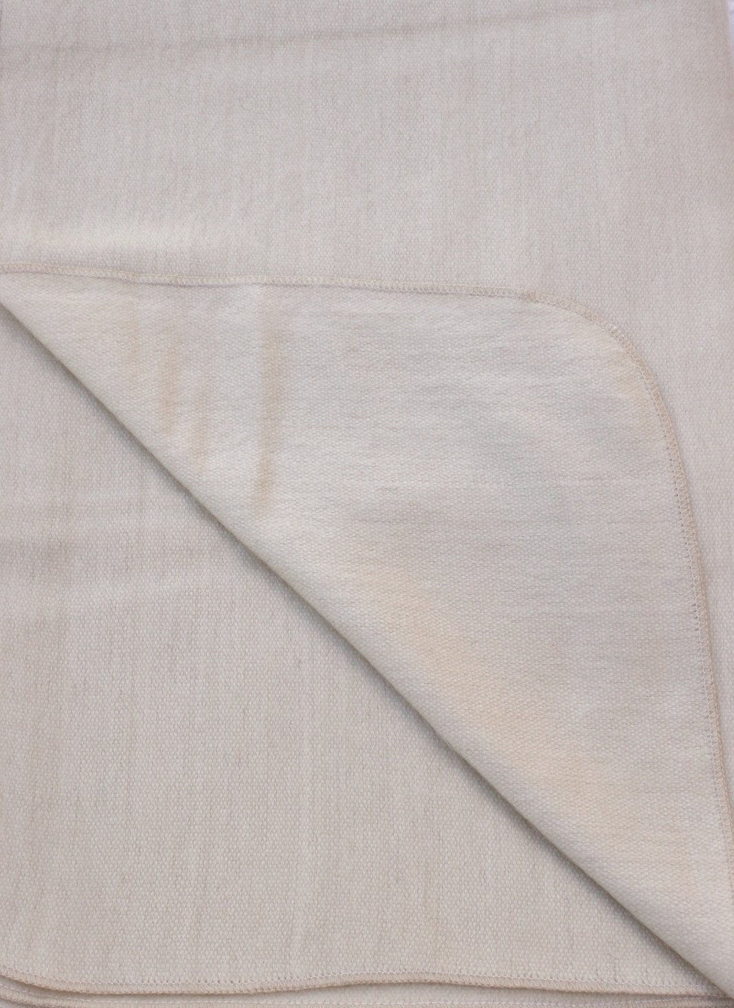 Close-up of beige fabric with a subtle pattern