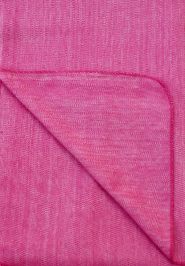 Close-up of pink fabric with a diagonal fold